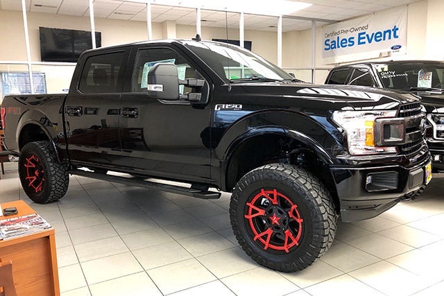 Black F-150 with Jimmie Allen Red Rims at All American Ford Point Pleasant in Point Pleasant NJ