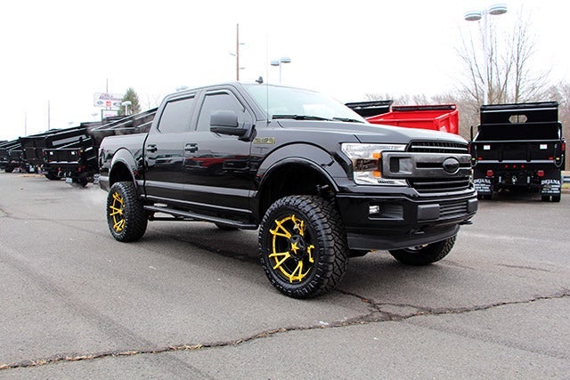 Custom Black F-150 with Jimmie Allen Yellow Rims at All American Ford Point Pleasant in Point Pleasant NJ